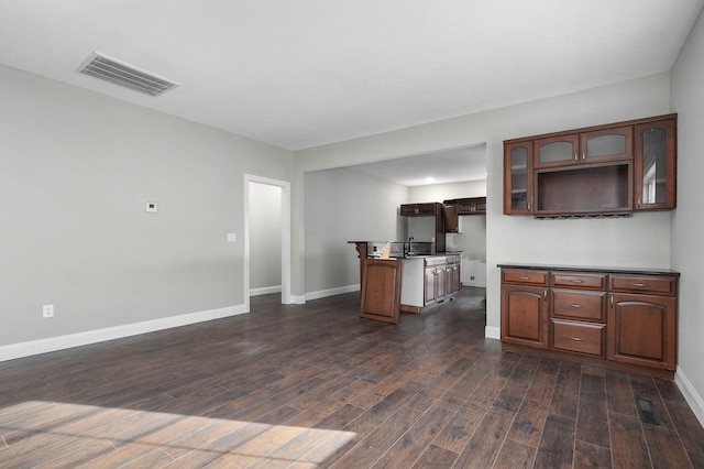 kitchen with dark hardwood / wood-style flooring