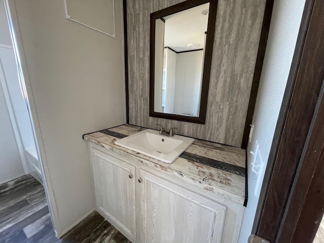 bathroom featuring vanity and hardwood / wood-style flooring