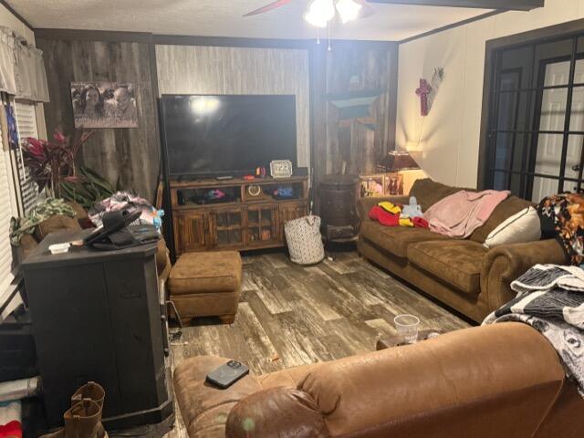 living room with hardwood / wood-style floors and ceiling fan