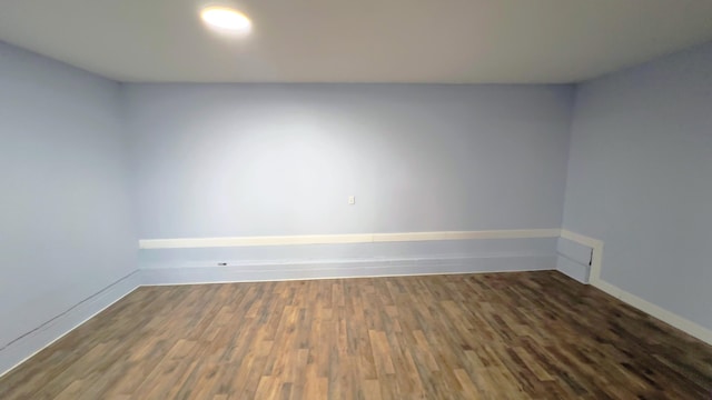 unfurnished room featuring dark hardwood / wood-style floors