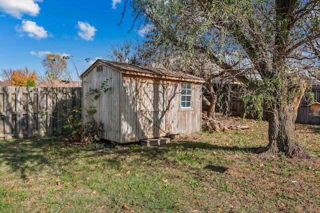 view of outdoor structure with a lawn