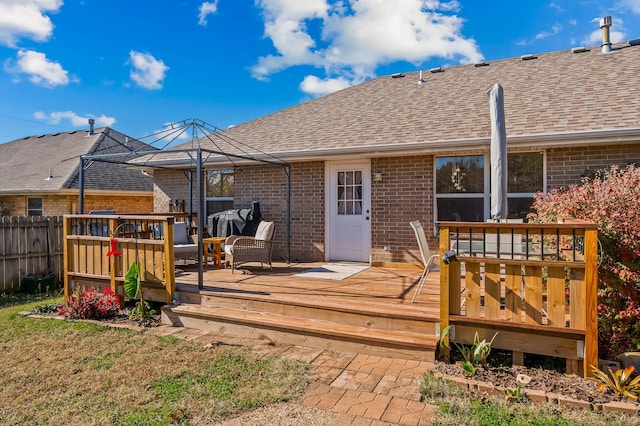 rear view of house featuring a deck