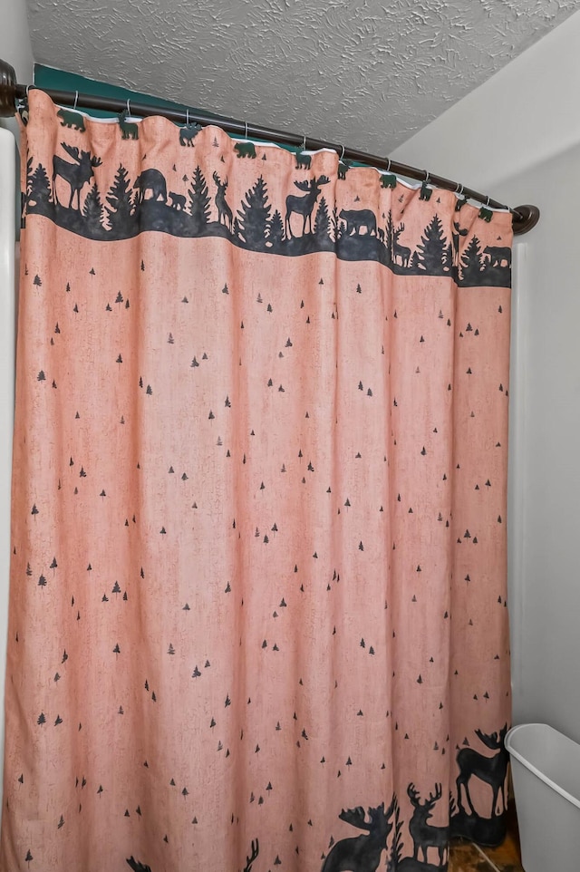 bathroom with a textured ceiling