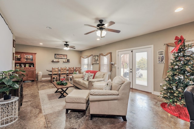 living room with finished concrete floors, baseboards, french doors, and recessed lighting