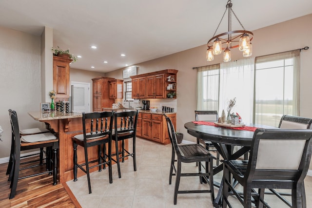 dining area with light tile patterned floors, recessed lighting, and baseboards