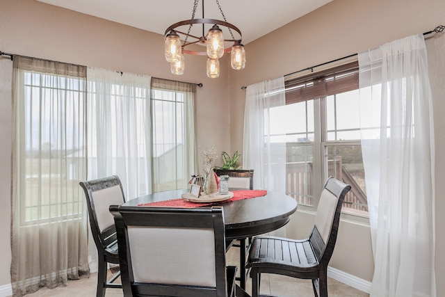 dining area featuring baseboards