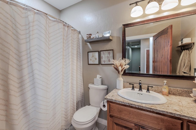 full bathroom featuring vanity and toilet