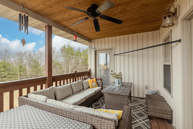 wooden deck featuring ceiling fan and an outdoor hangout area