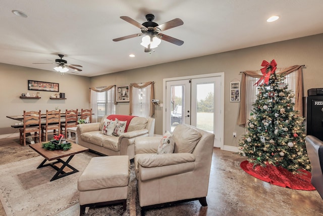 living area with baseboards, french doors, concrete floors, and recessed lighting