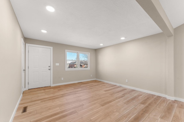 unfurnished room featuring light wood-type flooring