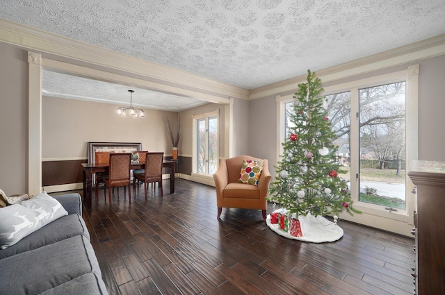 living room with a textured ceiling and a healthy amount of sunlight