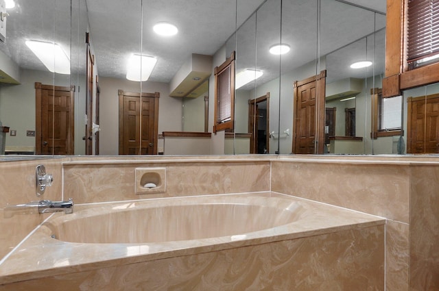 bathroom with a tub to relax in