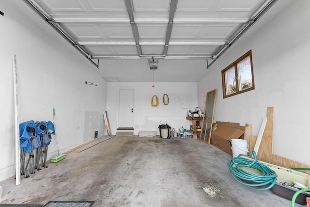 127 N Walnut St, Blue Eye, MO 65611 - garage featuring a garage door opener