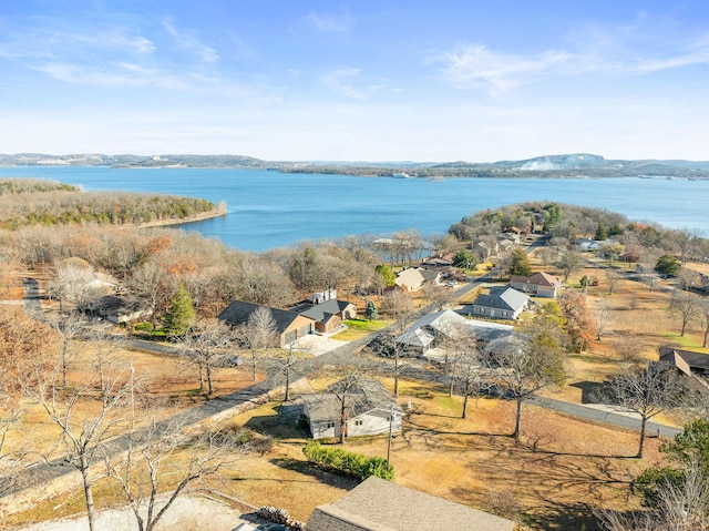 bird's eye view with a water and mountain view