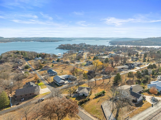 aerial view featuring a water and mountain view