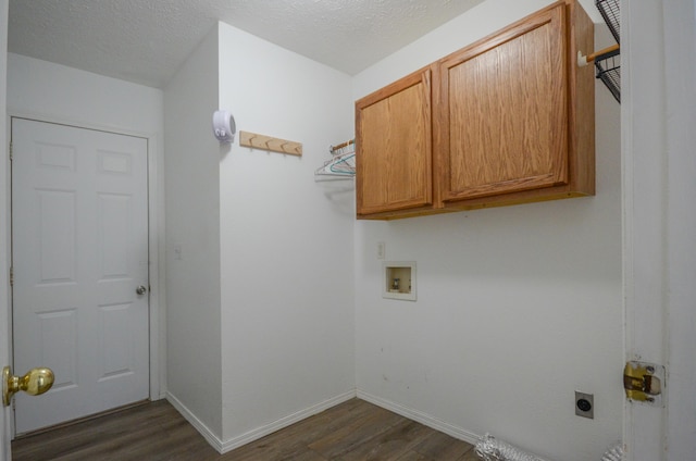 laundry room with electric dryer hookup, dark hardwood / wood-style floors, cabinets, and washer hookup