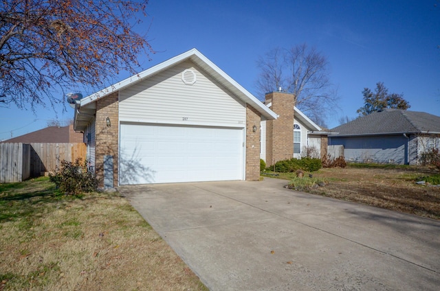 view of front of house with a front lawn and a garage