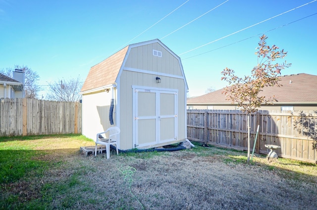 view of outbuilding featuring a lawn