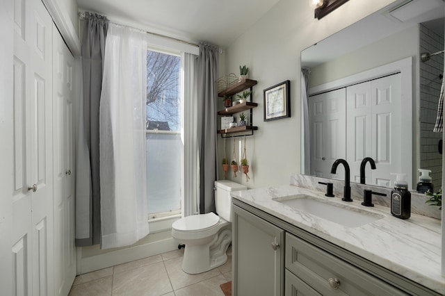 full bathroom with tile patterned flooring, vanity, toilet, and shower / tub combo