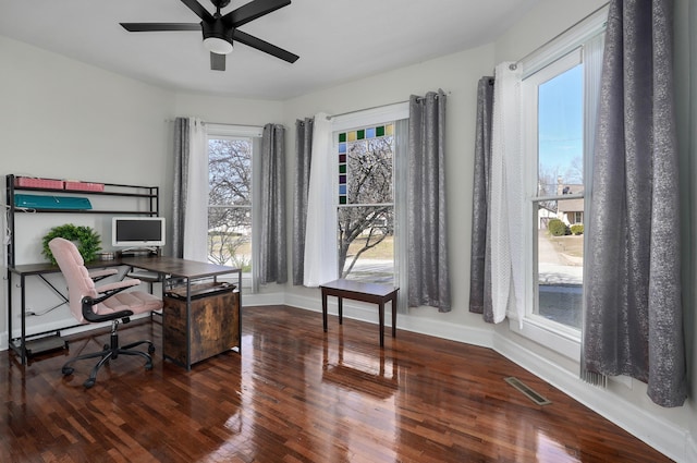 office with ceiling fan and dark hardwood / wood-style flooring