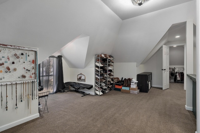 bonus room featuring carpet flooring and vaulted ceiling