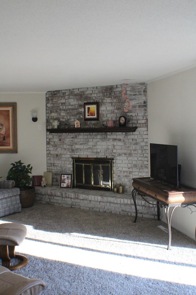 unfurnished living room featuring carpet and a brick fireplace