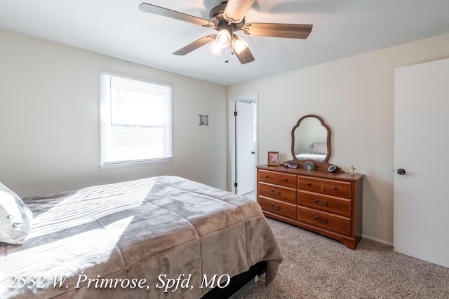 carpeted bedroom with ceiling fan