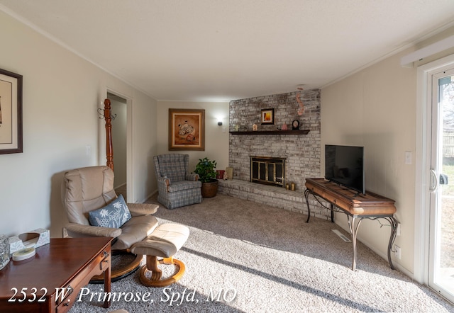 living room featuring carpet and a brick fireplace