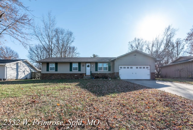 ranch-style home with a front lawn and a garage