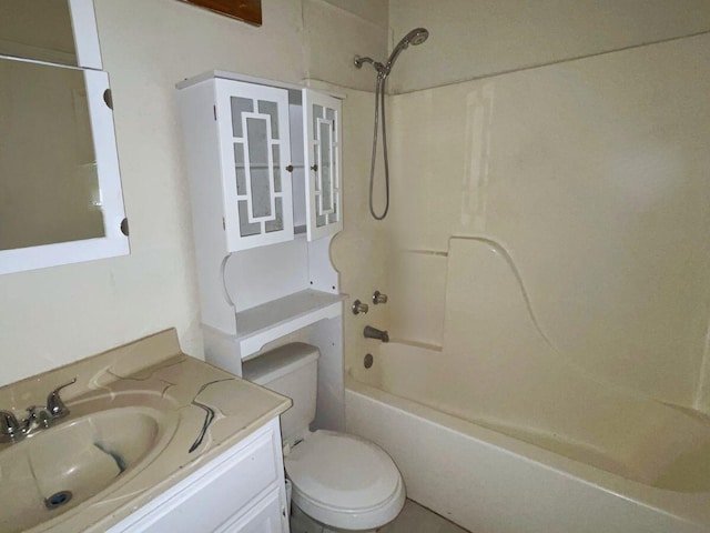 full bathroom featuring toilet, vanity, and washtub / shower combination