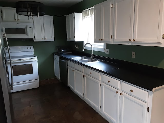 kitchen featuring white appliances, white cabinetry, and sink