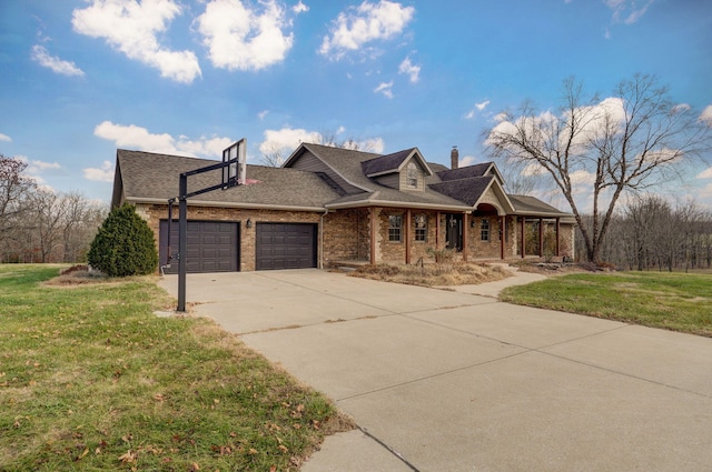 view of front of property featuring concrete driveway, a front lawn, an attached garage, and brick siding