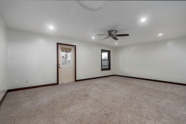 empty room with carpet, baseboards, a ceiling fan, and recessed lighting