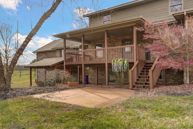 rear view of property with a patio area, stairs, and a wooden deck