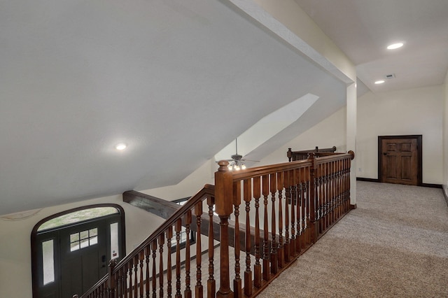 hallway featuring recessed lighting, carpet flooring, vaulted ceiling, an upstairs landing, and baseboards