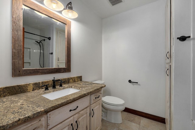 full bathroom featuring visible vents, toilet, vanity, baseboards, and walk in shower