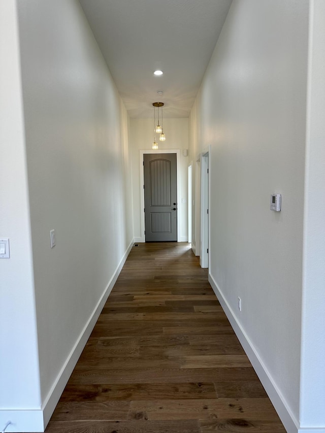 corridor with dark hardwood / wood-style floors