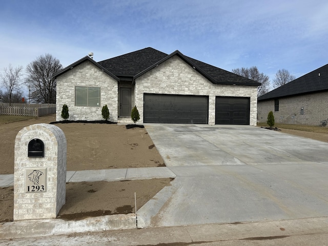 french provincial home with a garage