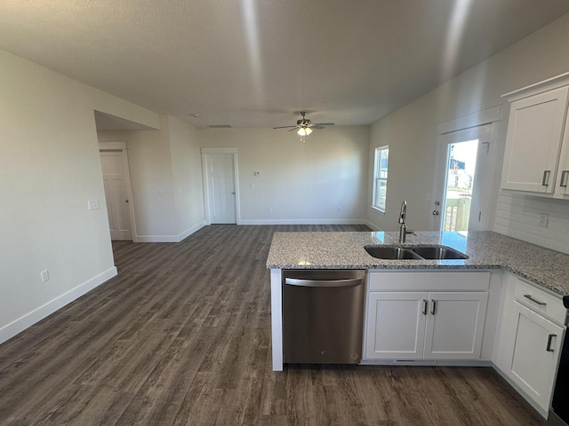 kitchen featuring stainless steel dishwasher, ceiling fan, dark wood-type flooring, sink, and white cabinetry