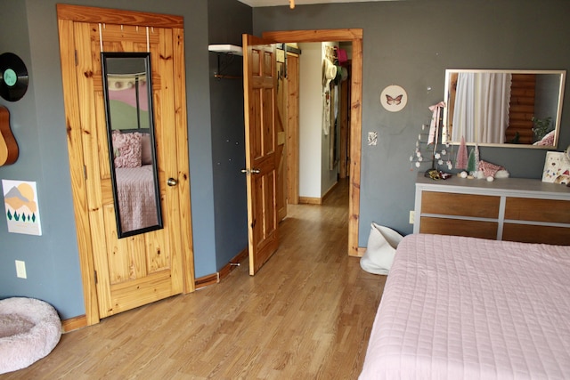 bedroom with light hardwood / wood-style floors