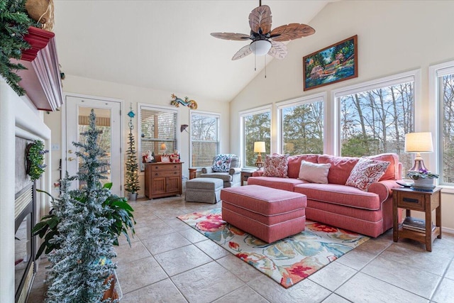 sunroom with ceiling fan and vaulted ceiling