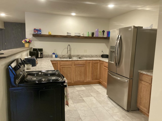 kitchen with sink and appliances with stainless steel finishes