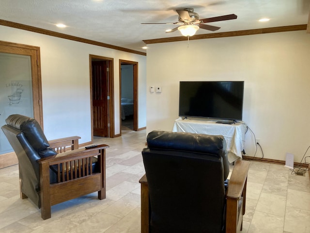 living room featuring crown molding, ceiling fan, and a textured ceiling