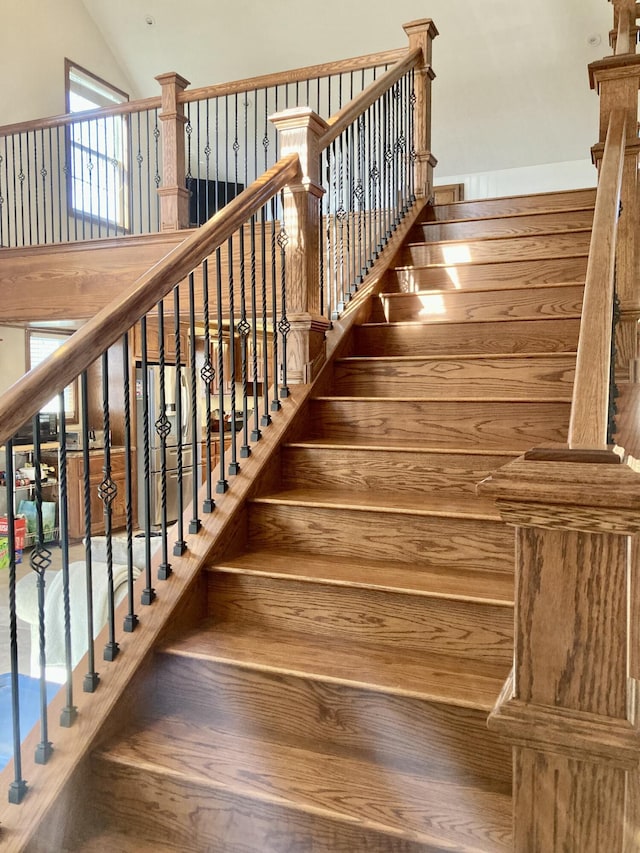 stairs with lofted ceiling