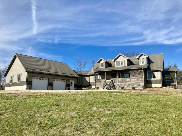 view of front facade featuring covered porch, a garage, and a front yard