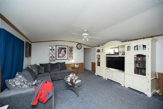 carpeted living room featuring lofted ceiling, a textured ceiling, ceiling fan, and crown molding