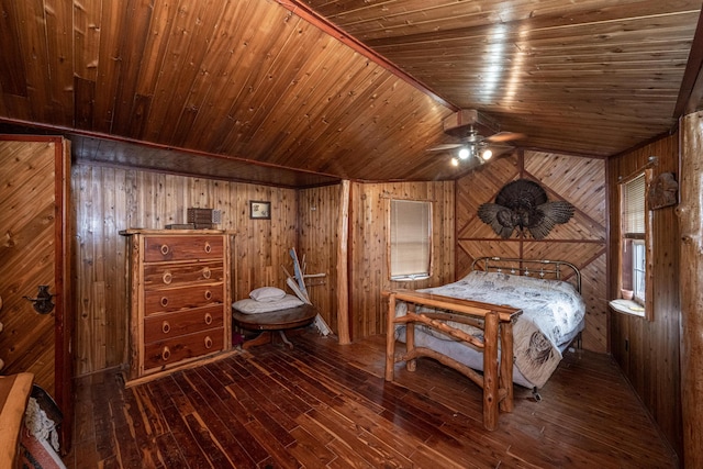 unfurnished bedroom with wooden ceiling, dark wood-type flooring, vaulted ceiling, and wooden walls