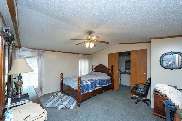 carpeted bedroom with a textured ceiling, ceiling fan, and vaulted ceiling