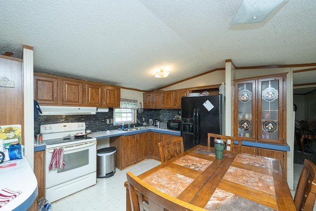 kitchen with a textured ceiling, vaulted ceiling, crown molding, and black appliances