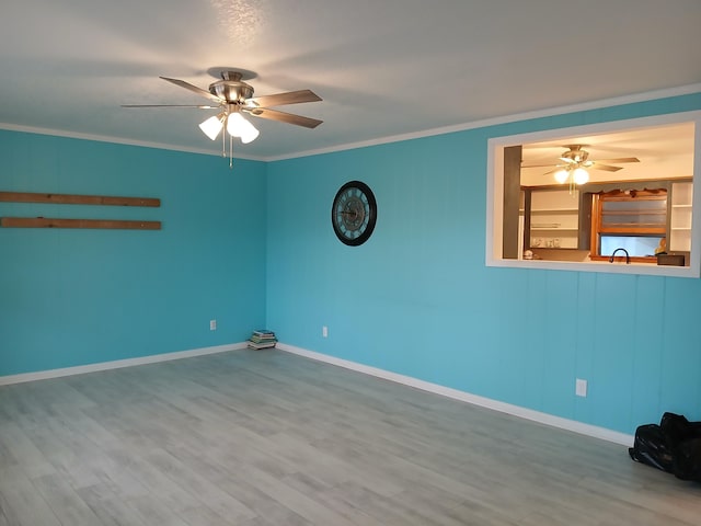 unfurnished room featuring ceiling fan, sink, ornamental molding, and hardwood / wood-style flooring